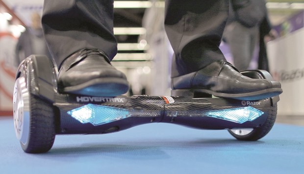 A man tries out the Hovertrax hoverboard at Nurembergu2019s toy fair.