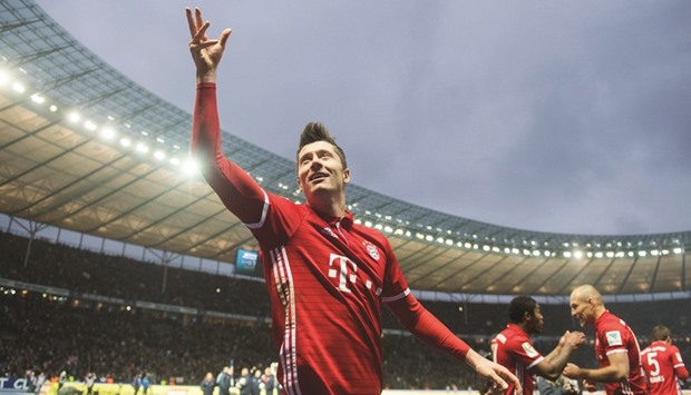 Bayern Munichu2019s Polish forward Robert Lewandowski celebrates after scoring against Hertha Berlin yesterday. (AFP)