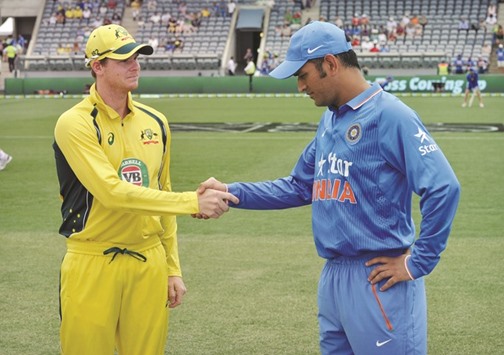 In this January 20, 2016, picture, Australiau2019s captain Steve Smith (left) and Indian captain MS Dhoni (right) shake hands before the start of the fourth ODI match at the Manuka Oval in Canberra. (AFP)