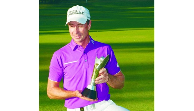 Brett Rumford of Australia poses with the winneru2019s trophy after winning the final of the new World Super 6 golf tournament in Perth yesterday. (AFP)