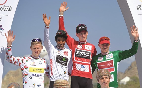 Belgiumu2019s Ben Hermans (second right) from BMC, Norwegian Alexander Kristoff (R) from Team Katusha Alpecin, Eritrean Merhawi Kudus (second left) from Team Dimension Data and Belgian Aime De Gendt from SVB team during the victory ceremony of the 8th edition of the cycling Tour of Oman yesterday. (AFP)