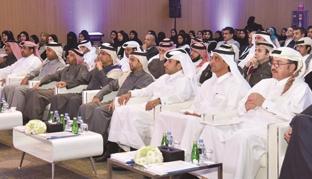 HE the Minister of Justice Dr Hassan Lahdan Saqr al-Mohannadi and senior officials from QU and QOC at the opening session of the conference yesterday. PICTURE: Noushad Thekkayil