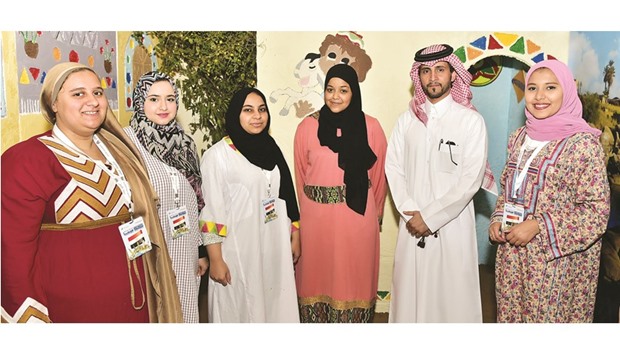 Students at one of the booths with Abdulla al-Yafei.