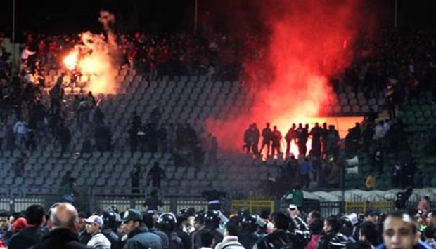 Football fans clash in the gallery in Port Said stadium, Egypt, on Feb. 1, 2012.