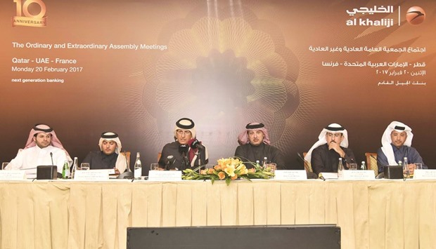 Sheikh Hamad and other directors at the Al Khaliji annual general assembly in Doha yesterday.