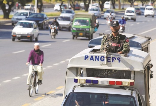 A Pakistani Rangers personnel keeps guard while patrolling on the streets in Islamabad, yesterday.