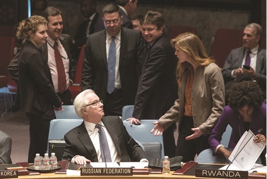 Churkin speaking with Power, then the American ambassador to the UN, before a vote regarding the Ukrainian crisis is taken at the UN Security Council in New York on March 15, 2014.