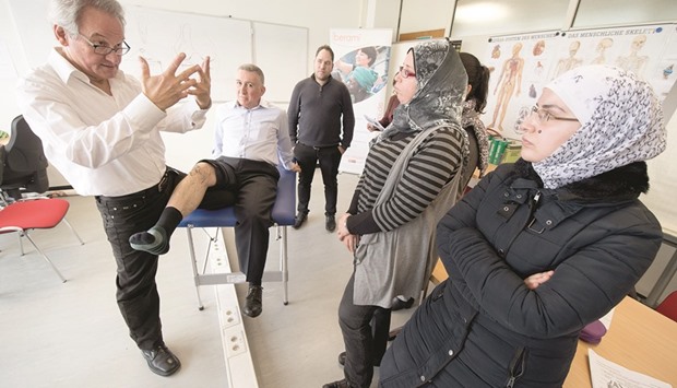 Germany offers special courses to doctors fleeing war-torn countries who want to adjust their skills to work in Europe.