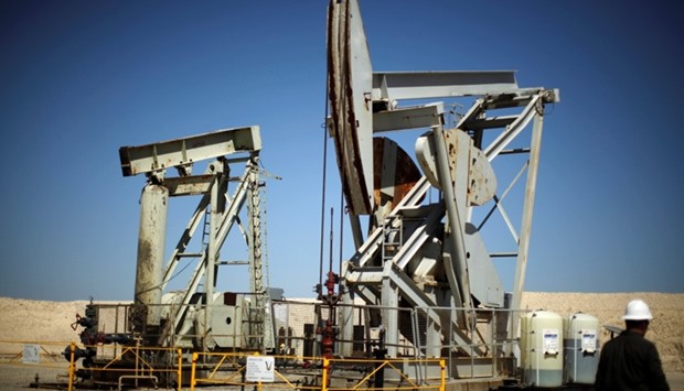 rising US output helped boost crude and gasoline inventories to record highs last week, amid faltering demand growth for the motor fuel.  Picture: Pump jacks drill for oil in the Monterey Shale, California, US