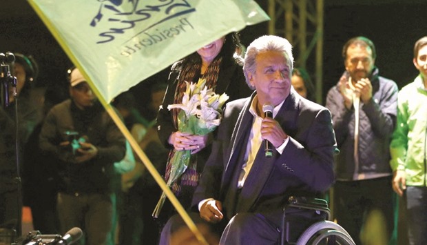 Lenin Moreno, candidate of the ruling PAIS Alliance Party, celebrates the early results of the presidential election with supporters in Quito.