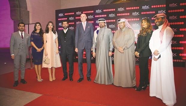 Waleed al-Sayed and Sam Barnett with celebrities and members of the team at the launch event.