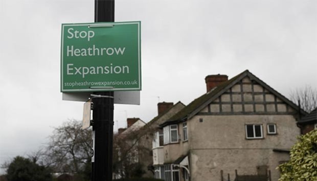 An anti-Heathrow airport expansion poster is seen in the village of Harmondsworth, close to the proposed site of the airport's third runway, near London, on Thursday.