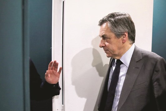 Francois Fillon (C), former French prime minister, member of The Republicans political party and 2017 presidential candidate of the French centre-right, visits the Salon des Entrepreneurs (Entrepreneurship fair) in Paris.