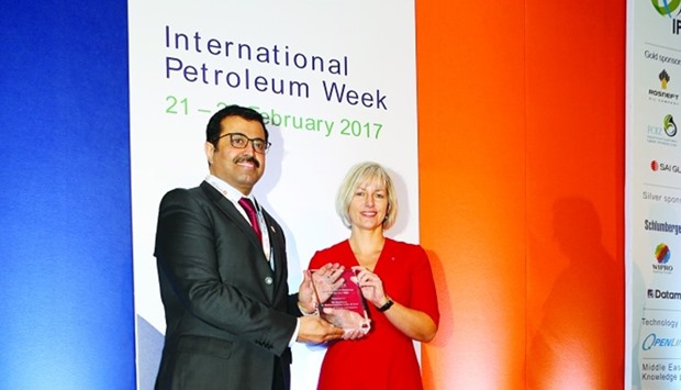 HE al-Sada receives the u2018International Oil Diplomacy Man of the Year 2016u2019 award from Kingham during the International Petroleum Week conference in London