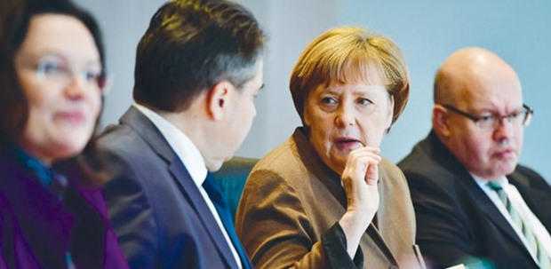 German Chancellor Angela Merkel (second from right) takes part in a weekly meeting of the German cabinet at the chancellery in Berlin yesterday. Executive bonuses are turning into a campaign issue in Germany as the Social Democrats propose curbing manager compensation, putting Merkelu2019s bloc on the spot seven months before national elections.