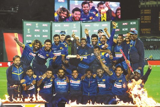 Sri Lankan players celebrate after clinching the T20 series over Australia after the third match in Adelaide yesterday. (Reuters)