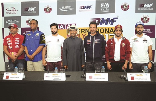 Qatar rally legend Nasser Saleh al-Attiyah (third right), QMMF president Abdulrahman al-Mannai (centre), Qatari drivers Khaled al-Suwaidi (second right) and Rashid al-Naimi (third left) and other drivers during the press conference yesterday at the Losail International Circuit. Picture: Nasar TK