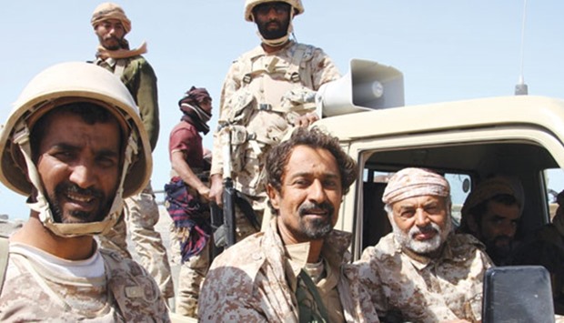 File photo shows Yemeni Army deputy chief of staff Major General Ahmed Saif al-Yafei (right) speaking to soldiers from inside a vehicle at the port of the western Yemeni coastal town of Mokha.