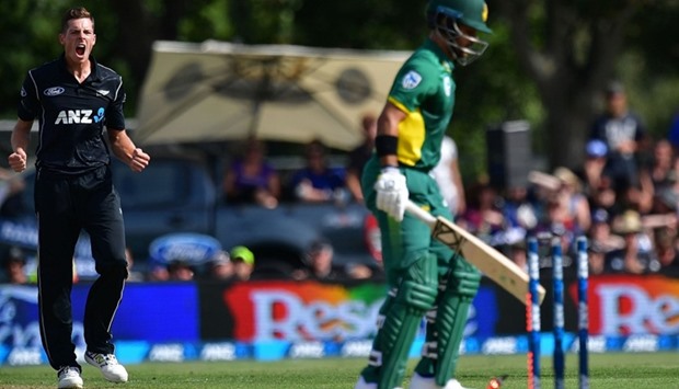New Zealand's Mitchell Santner (L) celebrates South Africa's Jean-Paul Duminy (R) being stumped during the second one-day international (ODI) cricket match between New Zealand and South Africa at the Hagley Park Oval in Christchurch.