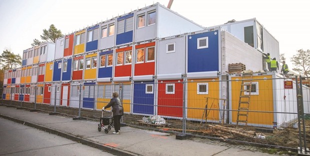 Containers at a construction site for a refugee centre in the Koepenick district of Berlin. Higher state spending on refugees was a factor in boosting Germanyu2019s overall economic growth to 1.9% last year, separate data from the Statistics Office showed.