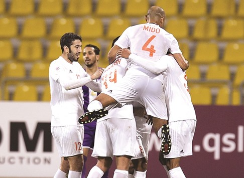 Umm Salal celebrate their goal against Muaither in the QSL yesterday.