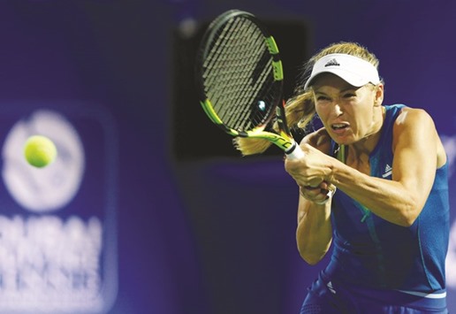 Caroline Wozniacki of Denmark returns to Catherine Bellis of USA. Wozniacki won 6-3, 6-2. (Reuters)