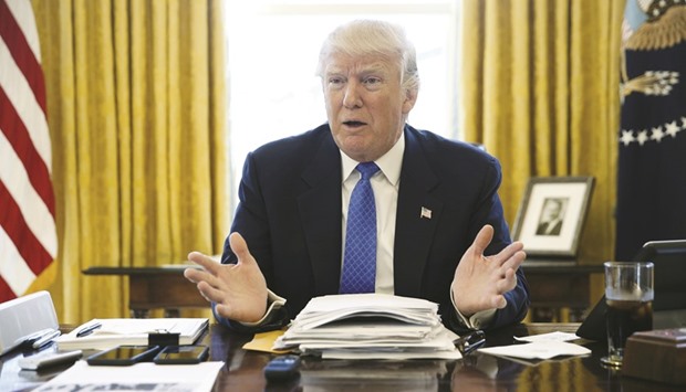 US President Donald Trump is interviewed by Reuters in the Oval Office at the White House in Washington. Trump said he has not u2018held backu2019 in his assessment that China manipulates its yuan currency, despite not acting on a campaign promise to declare it a currency manipulator on his first day in office.