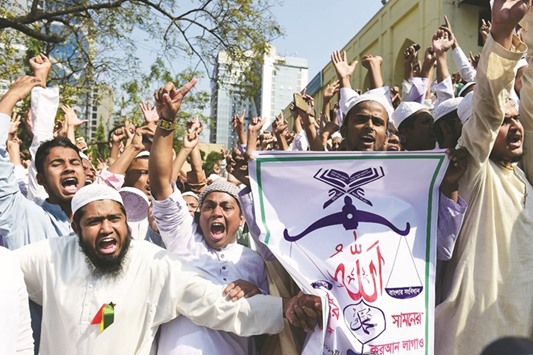 Activists from Hefazat-e-Islam shout slogans as they take part in a protest in Dhaka yesterday.