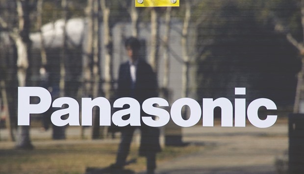 A man is reflected on Panasonic Corpu2019s logo in Tokyo. Oasis Management Cou2019s Seth Fischer increased his pressure on Panasonic to sweeten its offer for listed subsidiary PanaHome Corp, calling the transaction a test case of whether Japanu2019s corporate governance overhaul is working.
