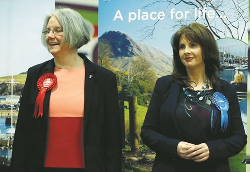 Labour Party candidate Gillian Troughton (left) looks away as Conservative Party candidate Trudy Harrison smiles after winning the Copeland by-election in Whitehaven, Britain, yesterday.