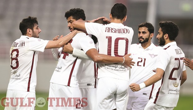 El Jaishu2019s Seydou Keita (No 24) celebrate with teammates after scoring against Al Ahli during their QSL match yesterday. PICTURE: Anas Khalid