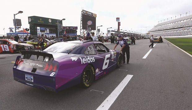 Crew members push the #6 Leidos Ford, driven by Darrell Wallace Jr (not pictured), on the grid during qualifying for the NASCAR XFINITY Series PowerShares QQQ 300 at Daytona International Speedway in Daytona Beach, Florida, yesterday.