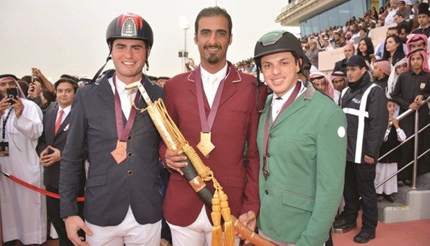 Qataru2019s Sheikh Ali bin Khalid al-Thani (centre) poses with runner-up Abdullah Alsharbatly (right) of Saudi Arabia and third placed Derin Demirsoy of Turkey after winning the feature class of the HH The Emiru2019s Sword International Showjumping Championship at the Qatar Equestrian Federationu2019s outdoor arena yesterday. PICTURES: Lotfi Garsi