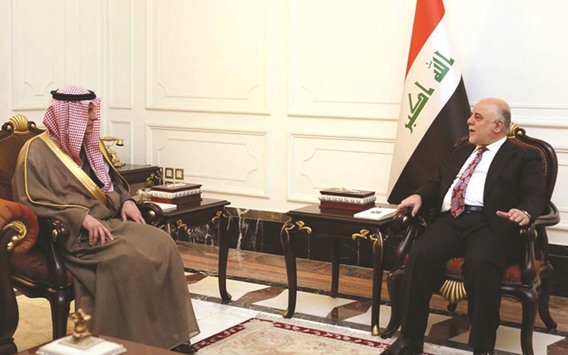 A handout picture released by the Iraqi Prime Ministeru2019s press office yesterday, shows Iraqi Prime Minister Haidar al-Abadi (right) meeting with Saudi Foreign Minister Adel al-Jubeir in Baghdad.