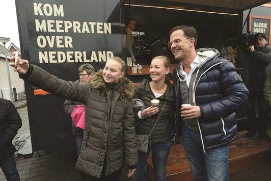 Rutte poses for a u2018selfieu2019 with locals in Wormerveer as he campaigns for re-election ahead of the March 15 vote.