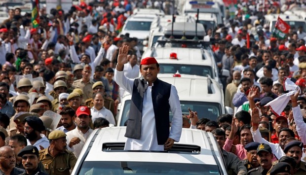 Akhilesh Yadav waves at his supporters during election campaign in Lucknow