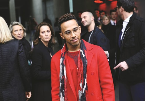 Lewis Hamilton arrives at the Emporio Armani Autumn/Winter collection show, part of the Milan Fashion Week, in Milan, on Saturday. (Reuters)