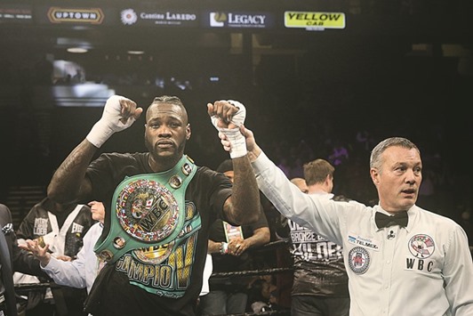 WBC world heavyweight champion Deontay Wilder is announced the winner in his fight against Gerald Washington in Birmingham. (AFP)