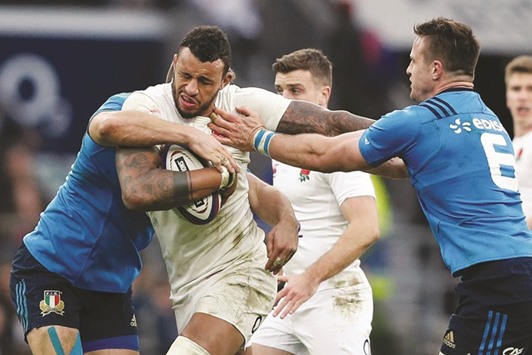 Englandu2019s lock Courtney Lawes is tackled during the Six Nations match against Italy at Twickenham stadium in southwest London yesterday. (AFP)