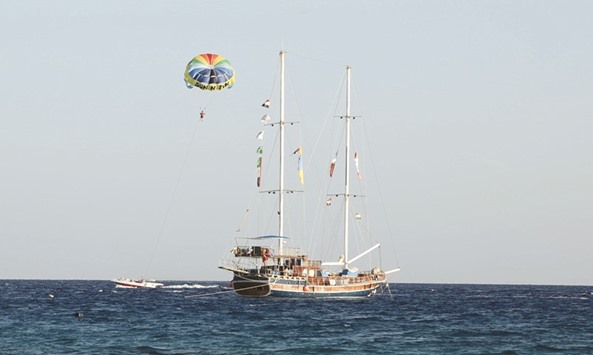 A tourist parasails over the sea in the Red Sea resort of Sharm el-Sheikh in this photo dated November 7, 2015. Egyptu2019s tourism sector is reeling from years of upheaval and a series of militant attacks including the 2015 bombing of a Russian airliner carrying holidaymakers home from Sharm el-Sheikh.