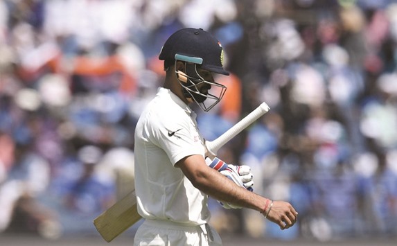 File picture of Indiau2019s captain Virat Kohli walking back after getting out on the third day of the first Test between India and Australia in Pune, India.