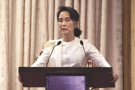 Myanmaru2019s State Counselor Aung San Suu Kyi speaks during a memorial ceremony for murdered lawyer Ko Ni and taxi driver Ne Win in Yangon.