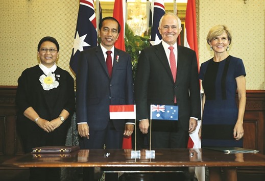 Australian Minister for Foreign Affairs Julie Bishop (right) and her Indonesian counterpart Retno Marsudi (left) pose for photos with Indonesian President Joko Widodo (second left) and Australian Prime Minister Malcolm Turnbull at Admiralty House in Sydney.