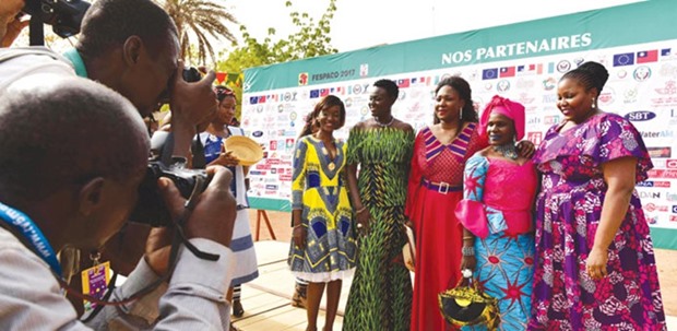 (From left) Frontieres actresses Naki Sy Savane, Unwana Udobang, Burkinabe director Appoline Traor, Adizetou Sidi and Amelie Mbaye, arrive for the screening of the 25th Panafrican cinema and television festival in Ouagadougou on Sunday.