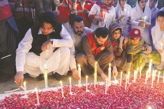 Mourners light candles two days after the bombing attack on the hospital in Quetta.