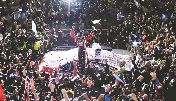 Kurt Busch, driver of the #41 Haas Automation/Monster Energy Ford, celebrates after winning the 59th Annual Daytona 500.