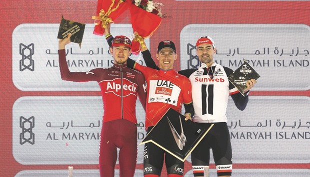 (From left) Second-placed Ilnur Zakarin of Team Katusha Alpecin, Tour of Abu Dhabi winner Rui Costa of UAE Abu Dhabi and third-placed Tom Dumoulin of Team Sunweb celebrate on the podium after the fourth and final stage of the Tour of Abu Dhabi on Sunday. (AFP)