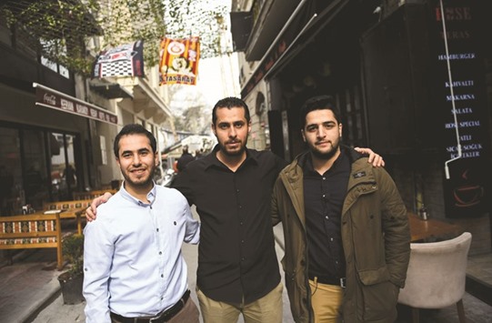Members of White Helmets film, Syrian cinematographers Khaled Khatib (right) and Fadi al-Halabi (left), and team member Abdelrahman al-Mawass, pose in Istanbul yesterday, a day after the film won the Oscar for best documentary in Hollywood.