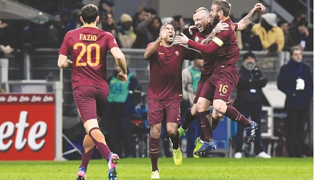 AS Romau2019s Radja Nainggolan (second right) celebrates with teammates after scoring against Inter Milan on Sunday night. (AFP)