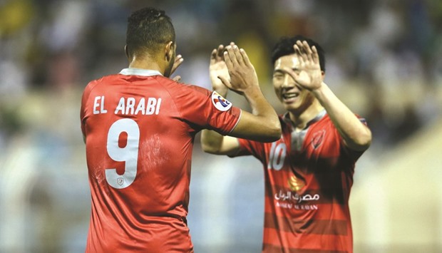 Lekhwiya scorers Youssef al-Arabi and Nam Tae-hee celebrate in Al Hasa yesterday.